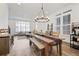 Open living spaces with dining area featuring large windows for great natural light at 3 Becker Nw Pl, Atlanta, GA 30307