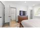 Main bedroom shows access to closet and a dresser and large television at 3 Becker Nw Pl, Atlanta, GA 30307