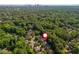 An aerial shot of the property showing its position surrounded by mature trees with convenient city access at 3182 Windsor Lake Ne Dr, Atlanta, GA 30319