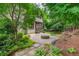 Enjoy the serene backyard with lush landscaping and a custom fire pit, perfect for outdoor gatherings at 3182 Windsor Lake Ne Dr, Atlanta, GA 30319