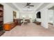 Spacious bonus room with neutral walls, carpet flooring, a day bed, a TV and modern decor with a ceiling fan at 3182 Windsor Lake Ne Dr, Atlanta, GA 30319