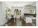 Sunlit eat-in kitchen featuring sleek countertops and modern pendant lighting at 3182 Windsor Lake Ne Dr, Atlanta, GA 30319