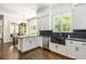 Bright kitchen with marble counters, stainless appliances, farmhouse sink and hardwood floors at 3182 Windsor Lake Ne Dr, Atlanta, GA 30319
