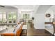 Open-concept living room flows seamlessly to breakfast nook and kitchen, with french doors to outdoors at 3182 Windsor Lake Ne Dr, Atlanta, GA 30319