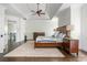 The expansive main bedroom features a tray ceiling, hardwood floors, and stylish decor at 3182 Windsor Lake Ne Dr, Atlanta, GA 30319