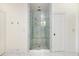 A luxurious bathroom with a glass enclosed marble shower and a bench at 3182 Windsor Lake Ne Dr, Atlanta, GA 30319