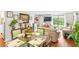 Open concept dining area flows into a sunlit living room with sliding glass doors to the backyard at 3184 Newcastle Way, Snellville, GA 30039