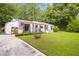 Charming one-story home with a spacious, well-maintained front lawn and a welcoming, decorated porch at 3184 Newcastle Way, Snellville, GA 30039