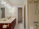 Bathroom featuring a vanity with a shower and bath at 5334 Post Road Pass, Stone Mountain, GA 30088