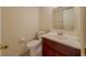 Bathroom with white toilet and sink at 5334 Post Road Pass, Stone Mountain, GA 30088