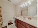 Bright bathroom features a single sink vanity and a toilet with tiled flooring at 5334 Post Road Pass, Stone Mountain, GA 30088