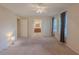 Spacious bedroom with neutral carpeting, windows, and ceiling fan at 5334 Post Road Pass, Stone Mountain, GA 30088