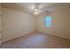 Empty bedroom with carpeted floors and a window allowing natural light at 5334 Post Road Pass, Stone Mountain, GA 30088