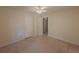 Bedroom featuring carpeted floors, neutral walls, and white doors at 5334 Post Road Pass, Stone Mountain, GA 30088