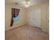 Bedroom with carpeted floors, natural light and a white ceiling fan at 5334 Post Road Pass, Stone Mountain, GA 30088