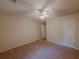 Spacious bedroom featuring neutral walls, carpet, and a ceiling fan at 5334 Post Road Pass, Stone Mountain, GA 30088