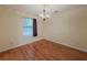 Dining room featuring hardwood floors, neutral walls, and natural light, creating a comfortable space at 5334 Post Road Pass, Stone Mountain, GA 30088