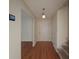 Entryway featuring hardwood floors, neutral walls, a coat closet, and a staircase leading to the upper level at 5334 Post Road Pass, Stone Mountain, GA 30088