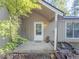 Close up of the front entrance of a house, showing the porch, front door, and house numbers at 5334 Post Road Pass, Stone Mountain, GA 30088