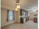 The kitchen has a tile floor, dark cabinets, and a stainless steel dishwasher at 5334 Post Road Pass, Stone Mountain, GA 30088