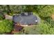 An aerial view of the home and property showcasing the lush, mature landscaping at 605 Buttercup Trce, Johns Creek, GA 30022