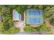 Community amenities featuring a pool and tennis courts, surrounded by lush greenery and residential streets at 605 Buttercup Trce, Johns Creek, GA 30022