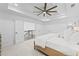 Bright bedroom featuring a ceiling fan, tray ceiling and neutral tones at 605 Buttercup Trce, Johns Creek, GA 30022