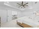 Spacious main bedroom featuring a tray ceiling, ceiling fan, and serene ambiance at 605 Buttercup Trce, Johns Creek, GA 30022