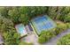 An aerial view of the community amenities, including tennis courts and a pool at 605 Buttercup Trce, Johns Creek, GA 30022