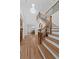 Grand foyer with a staircase, chandelier, and beautiful hardwood floors at 605 Buttercup Trce, Johns Creek, GA 30022