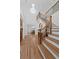 Grand foyer with staircase, hardwood floors, and elegant chandelier at 605 Buttercup Trce, Johns Creek, GA 30022