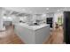 Modern kitchen with granite countertops, stainless appliances, open layout, and plenty of storage at 605 Buttercup Trce, Johns Creek, GA 30022