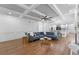 Spacious living room features coffered ceiling, hardwood floors and open floor plan at 605 Buttercup Trce, Johns Creek, GA 30022