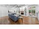Bright living room with hardwood floors, coffered ceiling, fireplace and doors leading to the outside at 605 Buttercup Trce, Johns Creek, GA 30022