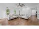 Inviting living room with coffered ceiling, hardwood floors and great natural light at 605 Buttercup Trce, Johns Creek, GA 30022