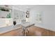 Bright home office featuring built-in shelving, hardwood floors, and a modern desk at 605 Buttercup Trce, Johns Creek, GA 30022