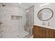 Beautiful shower features a built-in bench, designer tile, and updated hardware at 605 Buttercup Trce, Johns Creek, GA 30022