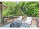 Enjoy outdoor living on this wooden back deck complete with seating and string lights at 709 Eastwood Rise, Stone Mountain, GA 30087