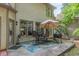 Outdoor patio space for entertaining with seating, a grill, and shade at 709 Eastwood Rise, Stone Mountain, GA 30087