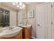 Bathroom with double vanity, framed mirrors, and modern lighting, providing a functional and stylish space at 709 Eastwood Rise, Stone Mountain, GA 30087