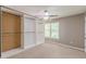 Cozy bedroom with a ceiling fan and ample closet space, perfect for organized storage at 709 Eastwood Rise, Stone Mountain, GA 30087
