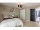 Inviting bedroom with decorative wall art, neutral tones, and a ceiling light, creating a serene and stylish space at 709 Eastwood Rise, Stone Mountain, GA 30087
