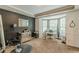 Bonus room featuring bay windows, carpet, tray ceilings and a dark accent wall that could be used as an office or salon at 709 Eastwood Rise, Stone Mountain, GA 30087