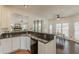 Open kitchen featuring sleek granite countertops and modern appliances at 709 Eastwood Rise, Stone Mountain, GA 30087