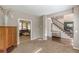 View from additional room to living room with hardwood floors, staircase, neutral paint and great natural light at 709 Eastwood Rise, Stone Mountain, GA 30087