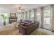 Spacious living room with a fireplace and large windows at 709 Eastwood Rise, Stone Mountain, GA 30087