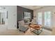 This main bedroom sitting area has an accent wall and a double door to the outside deck at 709 Eastwood Rise, Stone Mountain, GA 30087