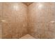 The tiled stand up shower stall features glass accents at 709 Eastwood Rise, Stone Mountain, GA 30087