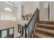 Bright foyer with staircase, chandelier, and transom window, providing an inviting entry to the home at 709 Eastwood Rise, Stone Mountain, GA 30087