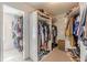 This walk-in closet offers ample storage and organization with built in shelving at 709 Eastwood Rise, Stone Mountain, GA 30087